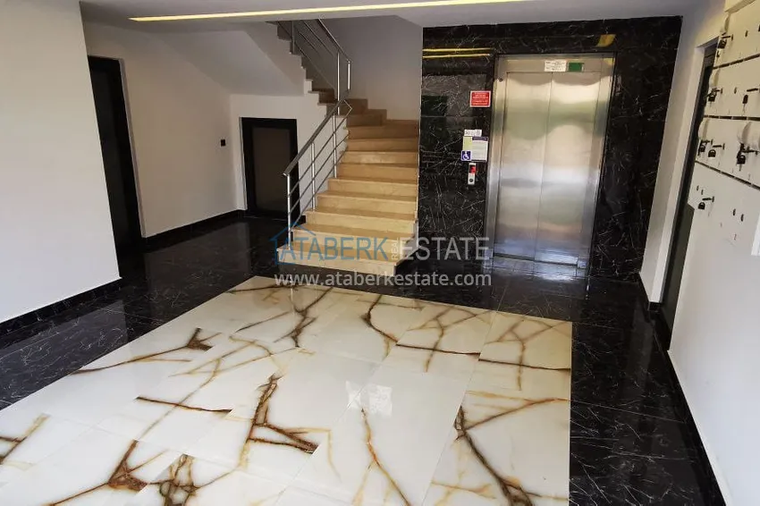 Квартира 1+1 с новой мебелью и видом на горы в Алании район Махмутлар 14 