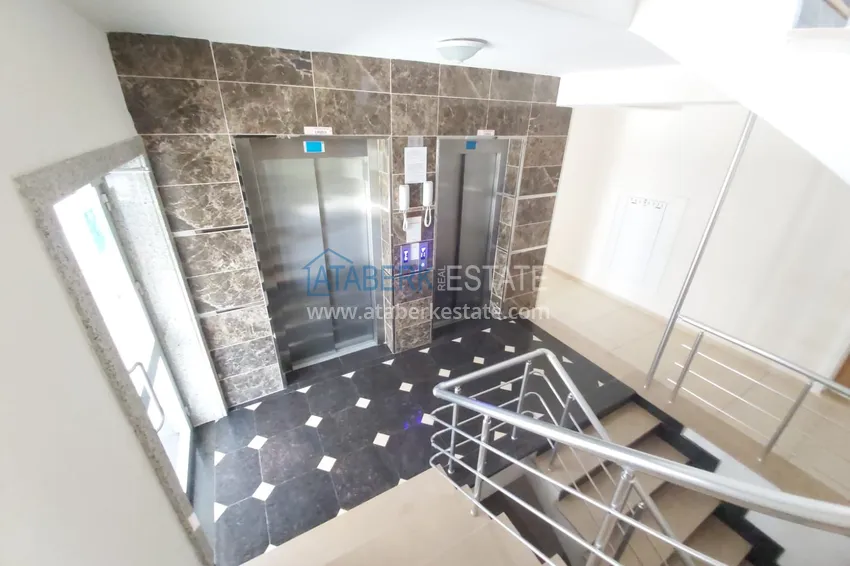 Просторная двухкомнатная квартира с тремя застеклёнными балконами в Алании, район Махмутлар 18 