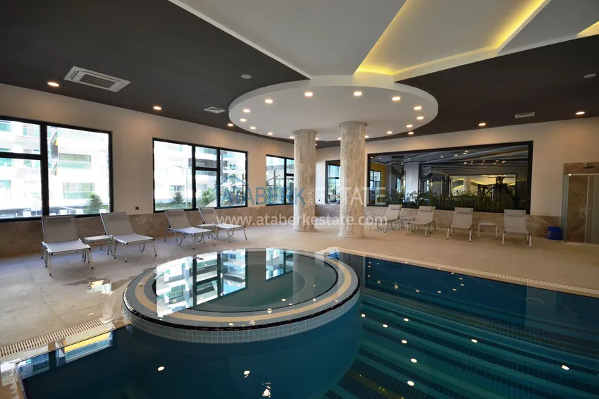 Квартира 1+1 с боковым видом на море в элитном комплексе с частным пляжем, Каргыджак – Алания 23 