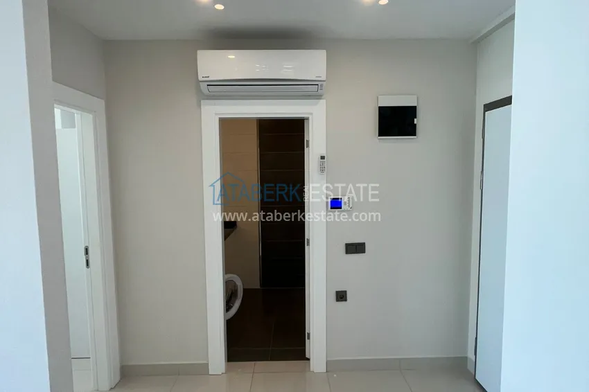 Приобрести Квартира 1+1 с боковым видом на море в элитном комплексе с частным пляжем, Каргыджак – Алания 2 