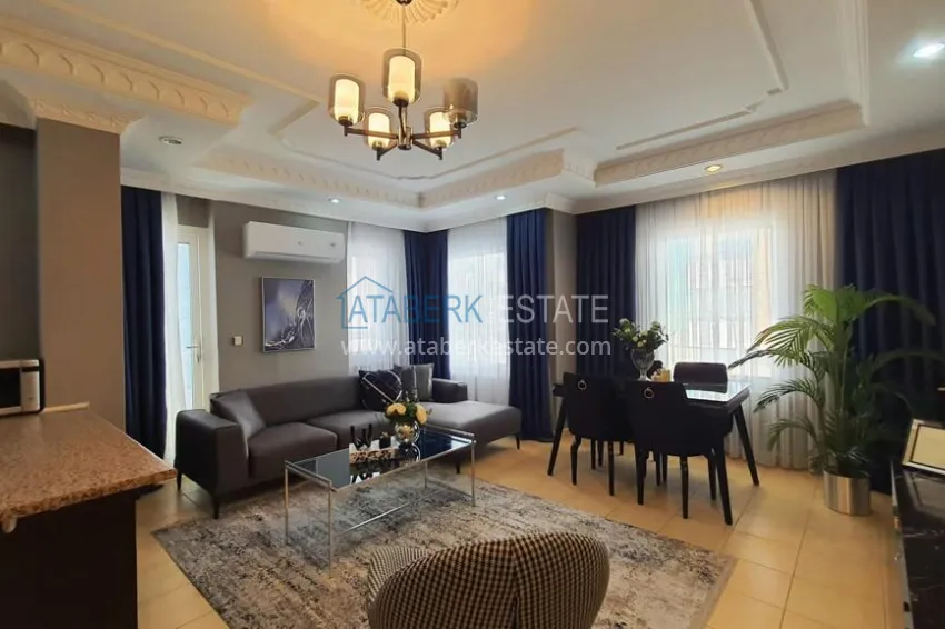 Приобрести Квартира 2+1 в центре Алании с новой современной мебелью и открытым видом из окна. Недвижимость подходит для ВНЖ 5 