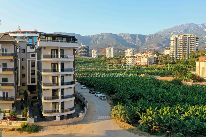 Квартира 1+1 с новой мебелью и видом на горы в Алании район Махмутлар 3 