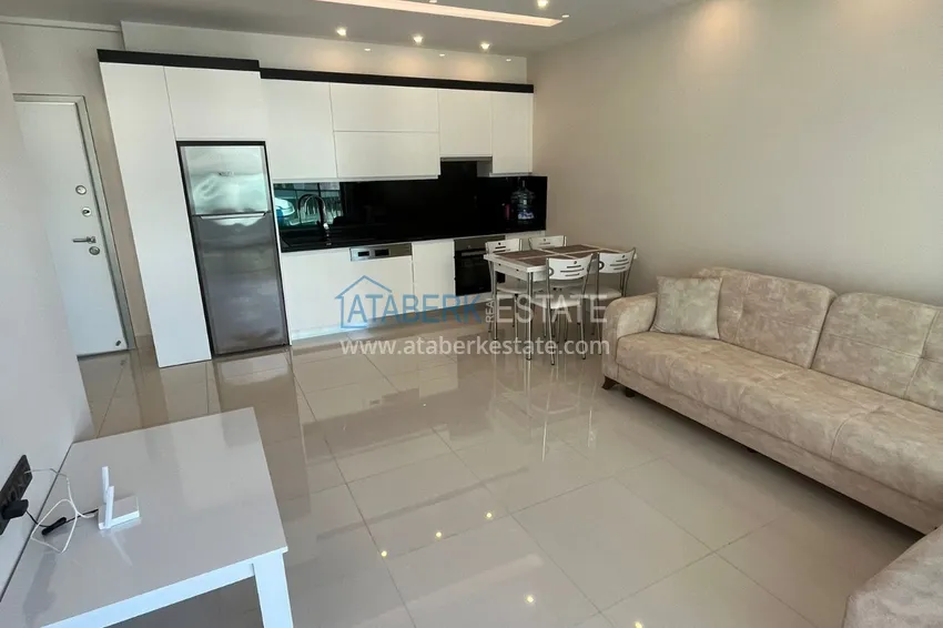 Приобрести Квартира 1+1 с боковым видом на море в элитном комплексе с частным пляжем, Каргыджак – Алания 5 