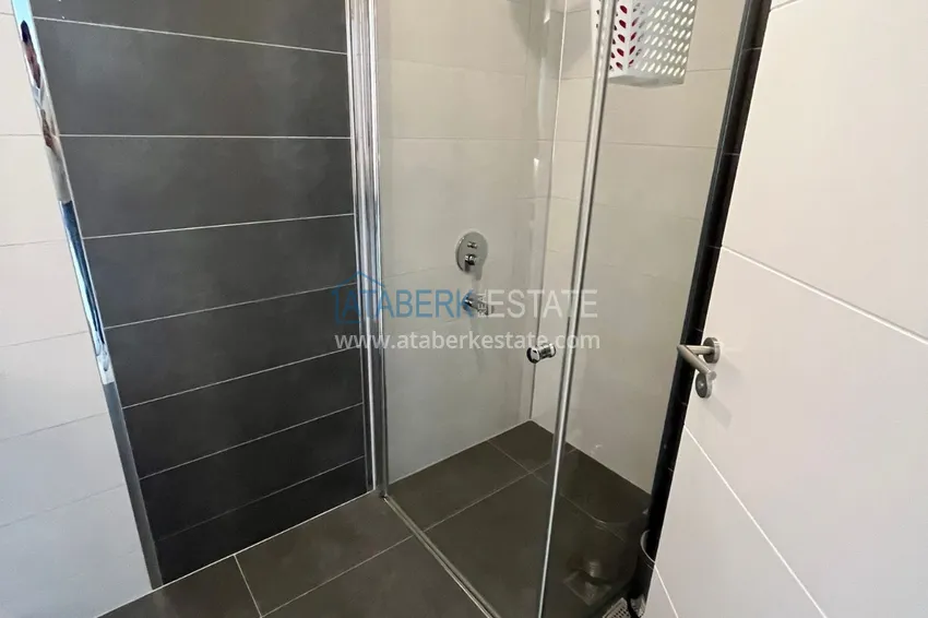 Приобрести Квартира 1+1 с боковым видом на море в элитном комплексе с частным пляжем, Каргыджак – Алания 9 