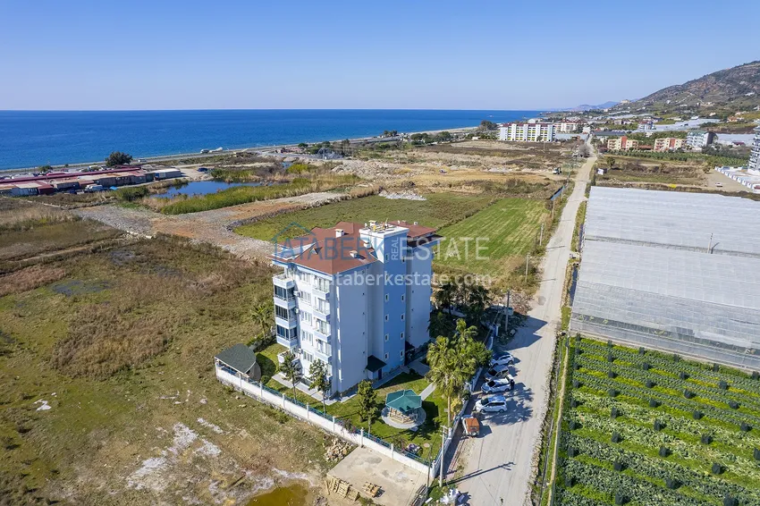 Квартира с дизайнерским интерьером в 200 метрах от моря в районе Алании открытом для ВНЖ - Демирташ 10 