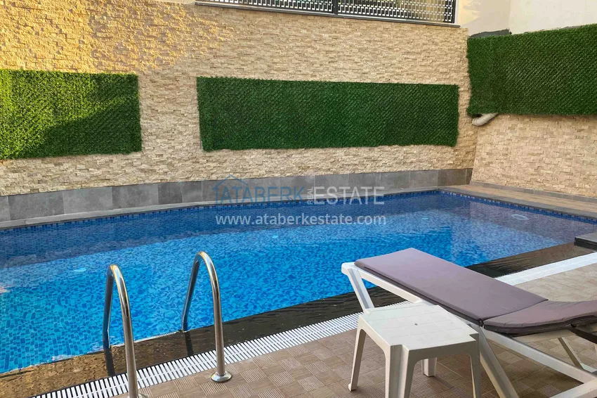 Квартира 1+1 с новой мебелью и видом на горы в Алании район Махмутлар 10 