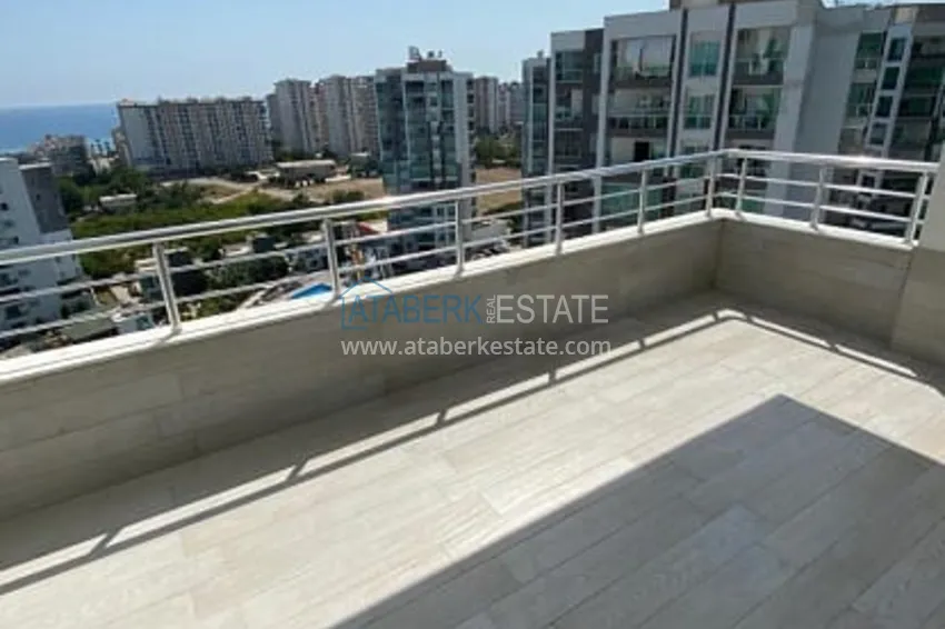 Приобрести Трехкомнатные апартаменты с видом на море и горе в уютном районе Томюк-Эрдемли 14 