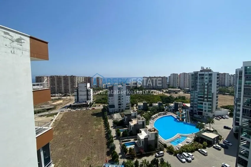 Приобрести Трехкомнатные апартаменты с видом на море и горе в уютном районе Томюк-Эрдемли 15 