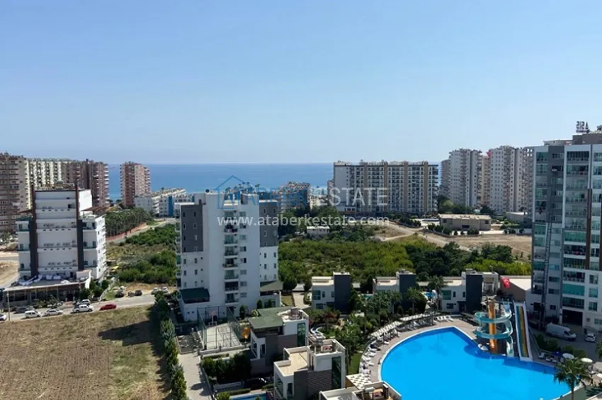 Приобрести Трехкомнатные апартаменты с видом на море и горе в уютном районе Томюк-Эрдемли 16 