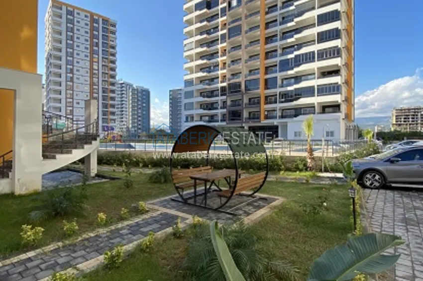 Квартира 2+1 с чистовой отделкой, в новом ЖК с инфраструктурой, в районе Арпачбахшиш-Мерсин 1 