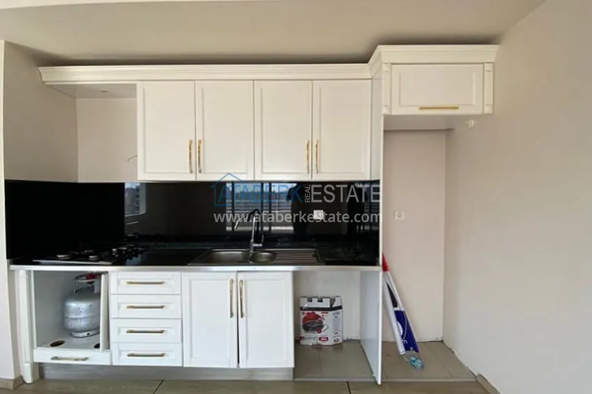 Приобрести Трехкомнатные апартаменты с видом на море и горе в уютном районе Томюк-Эрдемли 7 