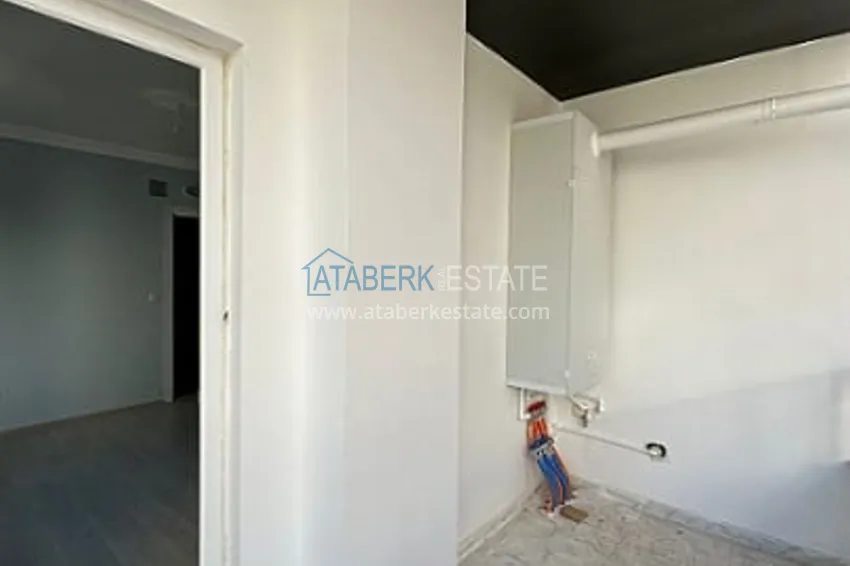 Приобрести Трехкомнатная квартира с застекленным балконом, в районе Эрдемли-Алата 19 