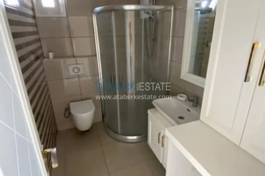 Приобрести Трехкомнатные апартаменты с видом на море и горе в уютном районе Томюк-Эрдемли 10 