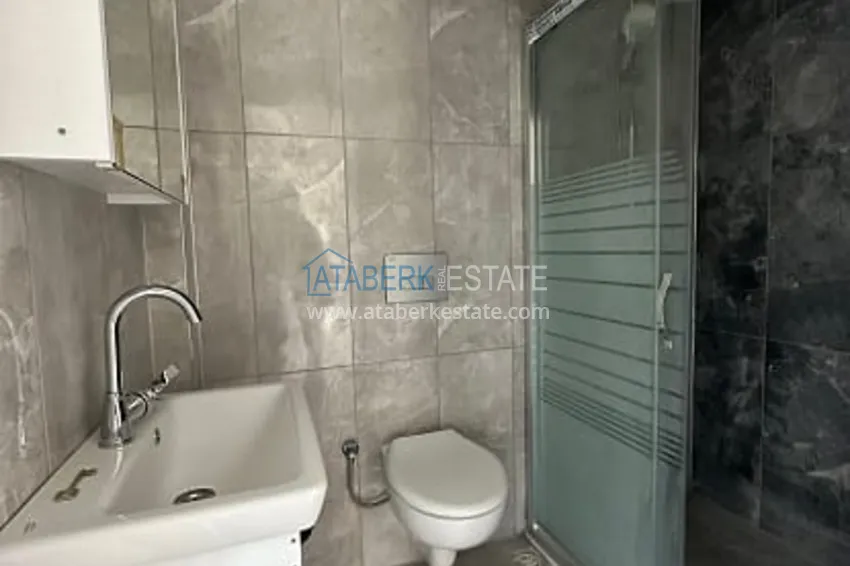 Приобрести Квартира 2+1 с чистовой отделкой, в новом ЖК с инфраструктурой, в районе Арпачбахшиш-Мерсин 15 