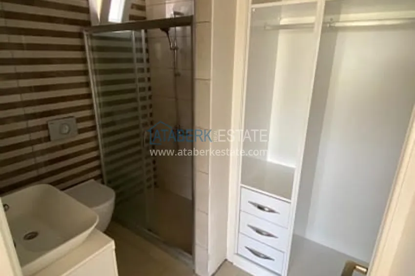 Приобрести Трехкомнатные апартаменты с видом на море и горе в уютном районе Томюк-Эрдемли 11 