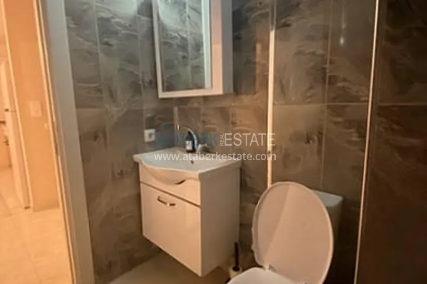 Приобрести Квартира 1+1 в развивающемся районе Мерсина-Арпачбахшиш 9 