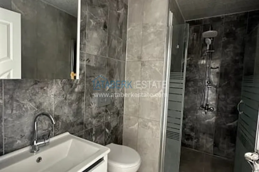 Приобрести Квартира 2+1 с чистовой отделкой, в новом ЖК с инфраструктурой, в районе Арпачбахшиш-Мерсин 16 