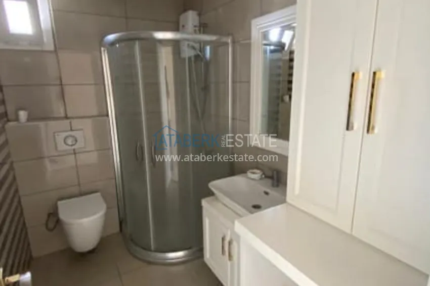 Приобрести Трехкомнатные апартаменты с видом на море и горе в уютном районе Томюк-Эрдемли 12 