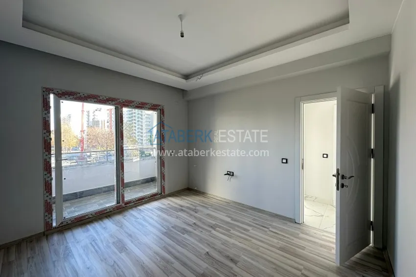 Приобрести Квартира 2+1 с чистовой отделкой, в новом ЖК с инфраструктурой, в районе Арпачбахшиш-Мерсин 5 