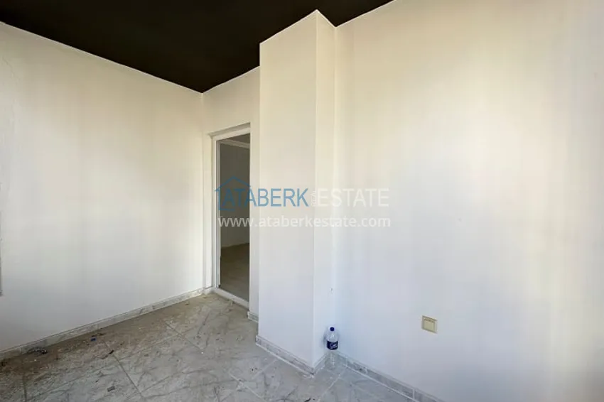 Приобрести Трехкомнатная квартира с застекленным балконом, в районе Эрдемли-Алата 18 