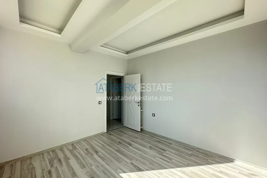 Приобрести Квартира 2+1 с чистовой отделкой, в новом ЖК с инфраструктурой, в районе Арпачбахшиш-Мерсин 8 