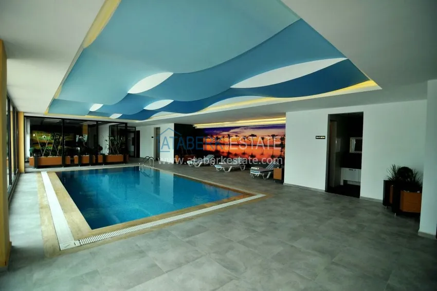 Садовый дуплекс 2+1 в Кестеле с мебелью в благоустроенном комплексе, подходит для гражданства 16 