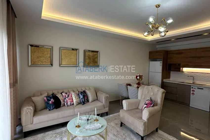 Приобрести Квартира 1+1 с новой мебелью, видом на море и горы, Махмутлар – Алания 12 