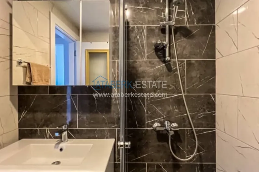 Приобрести Квартира 1+1 меблированная в роскошной резиденции возле пляжа Инджекум, район Авсаллар – Алания 12 