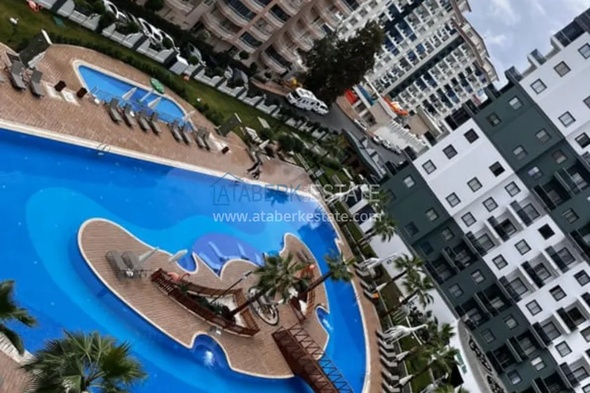 Приобрести Квартира 1+1 с мебелью в комплексе с инфраструктурой, район Махмутлар – Алания 11 