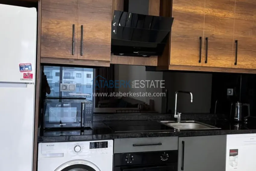 Приобрести Квартира 1+1 с мебелью в комплексе с инфраструктурой, район Махмутлар – Алания 4 