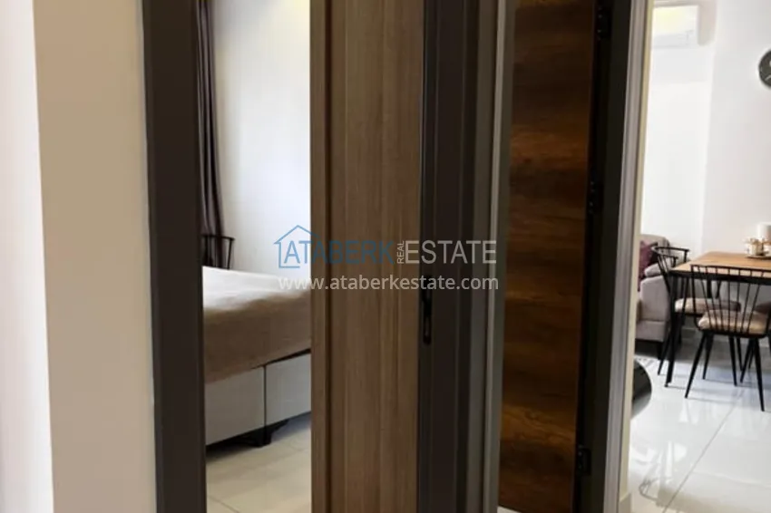 Приобрести Квартира 1+1 с мебелью в комплексе с инфраструктурой, район Махмутлар – Алания 5 