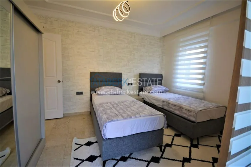 Приобрести Трехкомнатная квартира с мебелью в Махмутларе – район субботнего рынка 9 