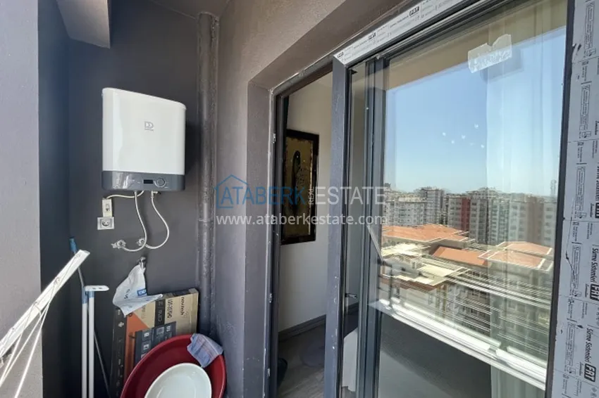 Приобрести Апартаменты 1+1 с мебелью и техникой, частично вид на море в районе Мезитли-Мерсин 30 