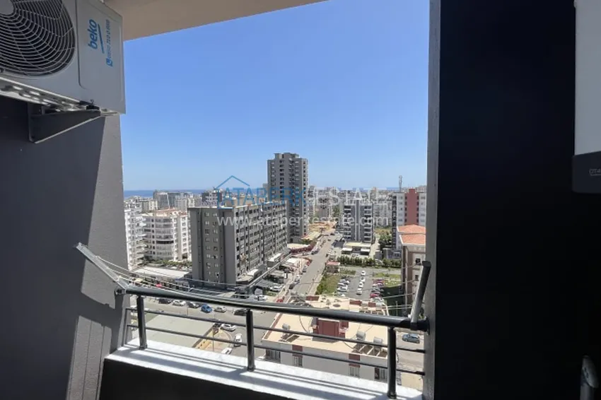 Приобрести Апартаменты 1+1 с мебелью и техникой, частично вид на море в районе Мезитли-Мерсин 31 