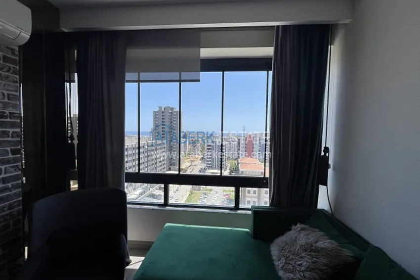 Приобрести Апартаменты 1+1 с мебелью и техникой, частично вид на море в районе Мезитли-Мерсин 32 