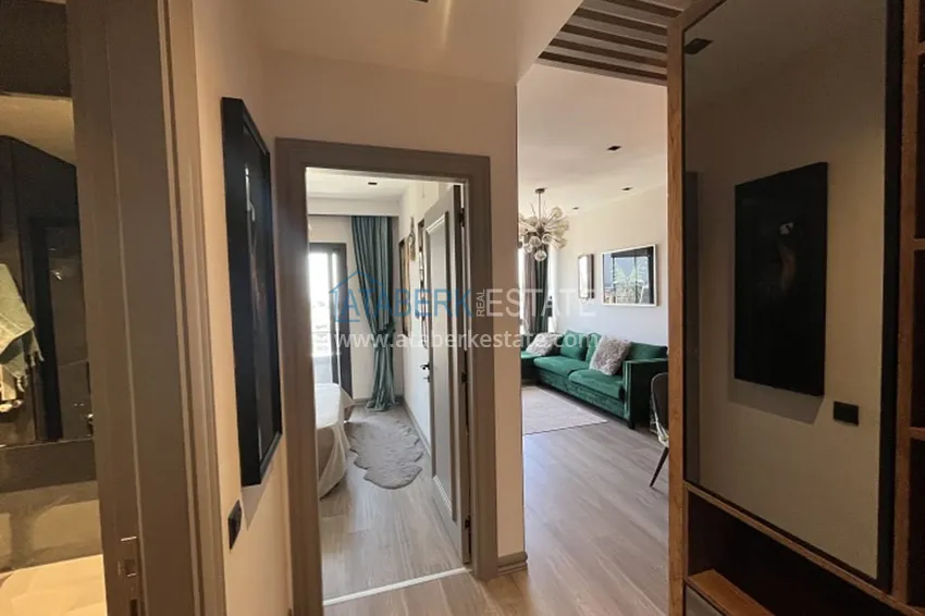 Приобрести Апартаменты 1+1 с мебелью и техникой, частично вид на море в районе Мезитли-Мерсин 26 