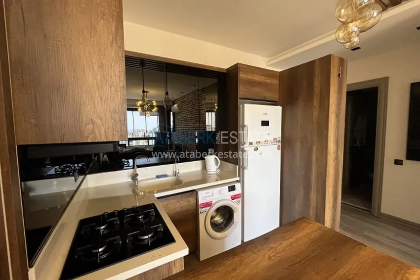 Приобрести Апартаменты 1+1 с мебелью и техникой, частично вид на море в районе Мезитли-Мерсин 16 