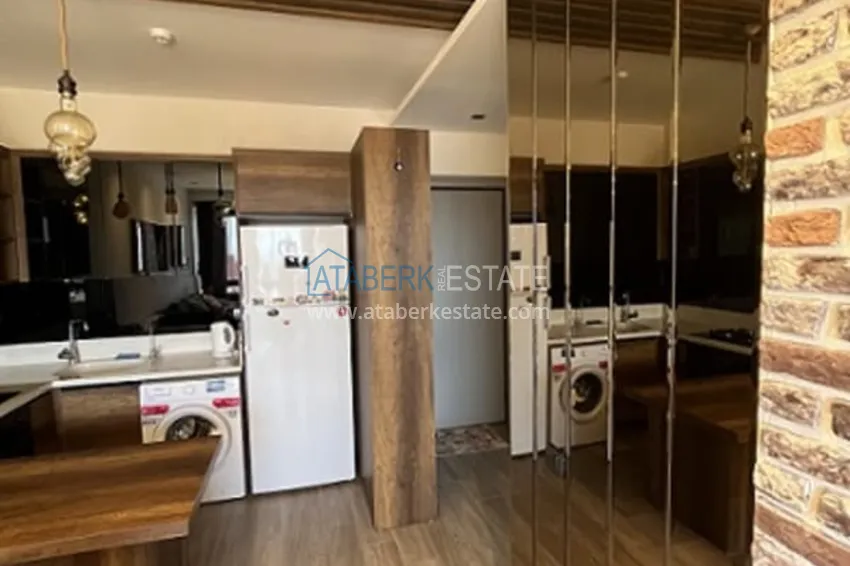 Приобрести Апартаменты 1+1 с мебелью и техникой, частично вид на море в районе Мезитли-Мерсин 17 