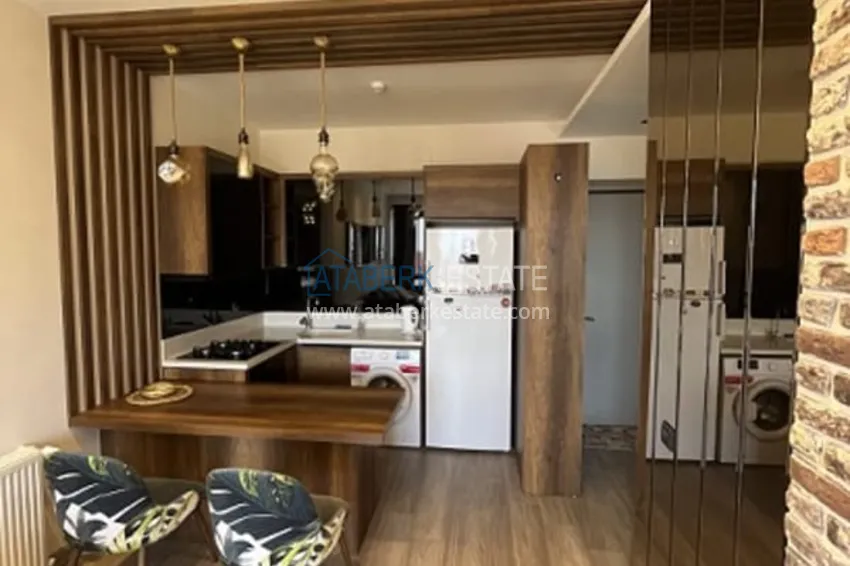 Приобрести Апартаменты 1+1 с мебелью и техникой, частично вид на море в районе Мезитли-Мерсин 18 