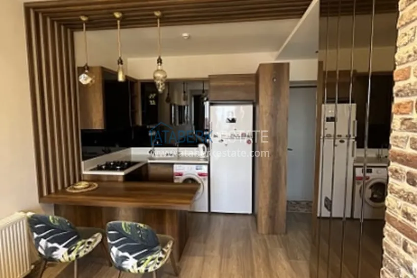 Приобрести Апартаменты 1+1 с мебелью и техникой, частично вид на море в районе Мезитли-Мерсин 19 