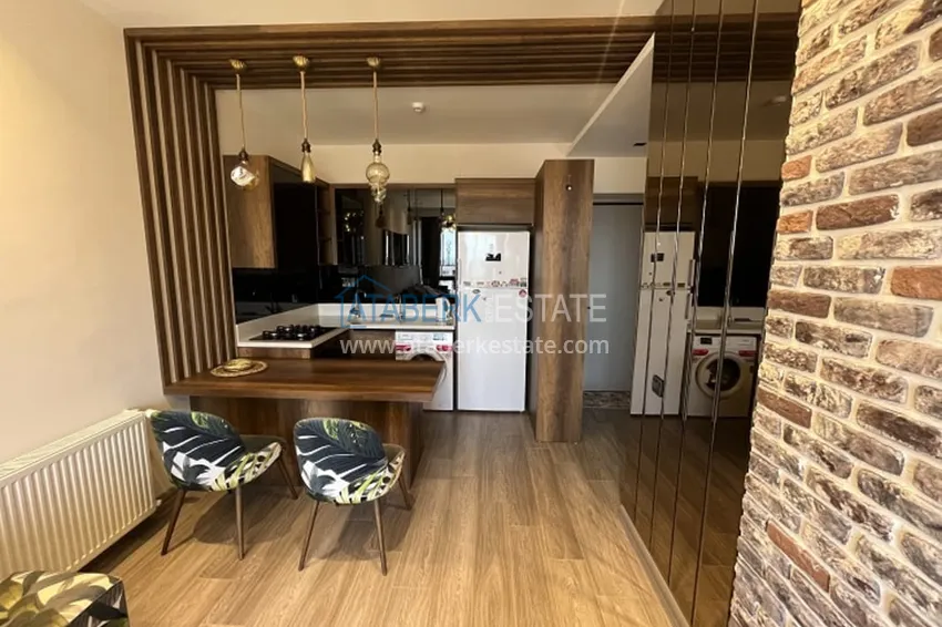 Приобрести Апартаменты 1+1 с мебелью и техникой, частично вид на море в районе Мезитли-Мерсин 20 