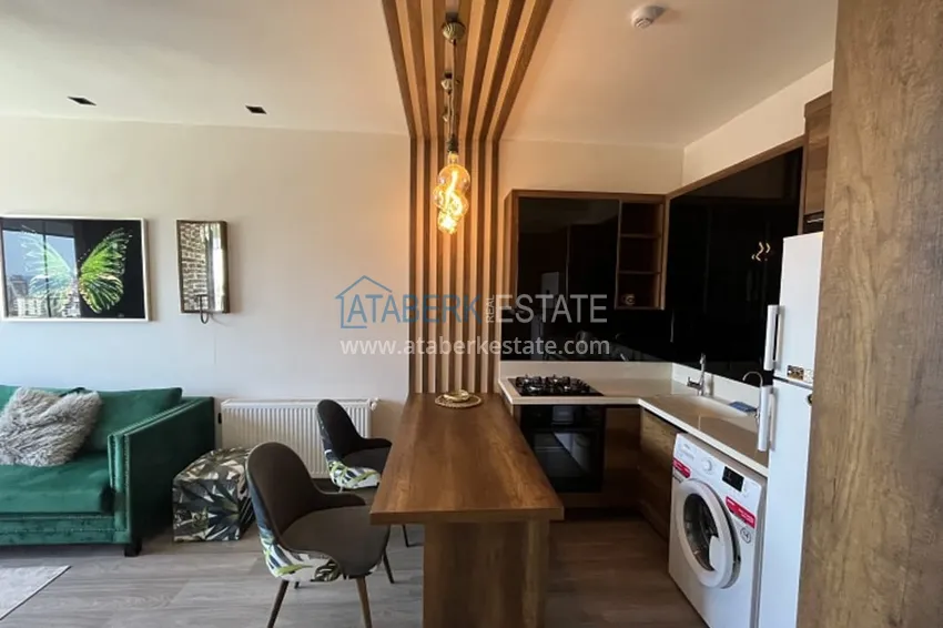 Приобрести Апартаменты 1+1 с мебелью и техникой, частично вид на море в районе Мезитли-Мерсин 21 