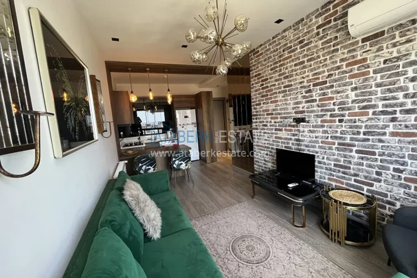 Приобрести Апартаменты 1+1 с мебелью и техникой, частично вид на море в районе Мезитли-Мерсин 3 