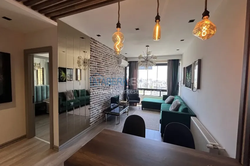 Приобрести Апартаменты 1+1 с мебелью и техникой, частично вид на море в районе Мезитли-Мерсин 5 