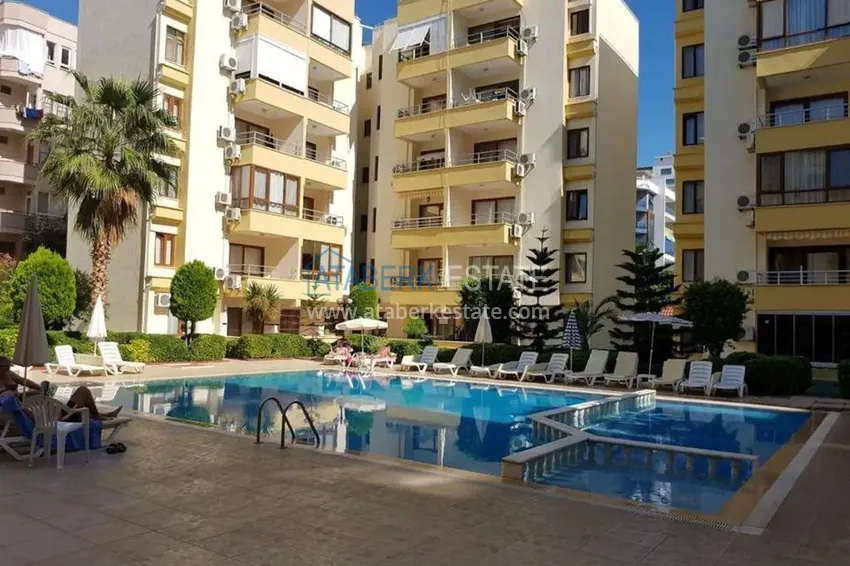 Квартира 1+1 меблированная в жилом комплексе с инфраструктурой, район Махмутлар – Алания  1 