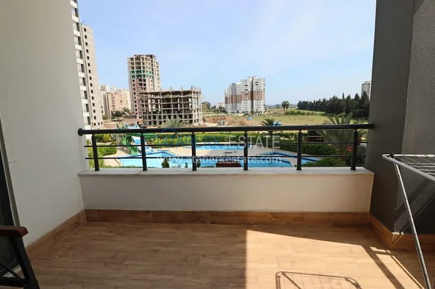 Приобрести Квартира 2+1 с мебелью и техникой в молодом комплексе в районе Тедже-Мерсин 15 