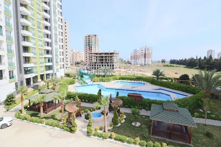 Квартира 2+1 с мебелью и техникой в молодом комплексе в районе Тедже-Мерсин 2 