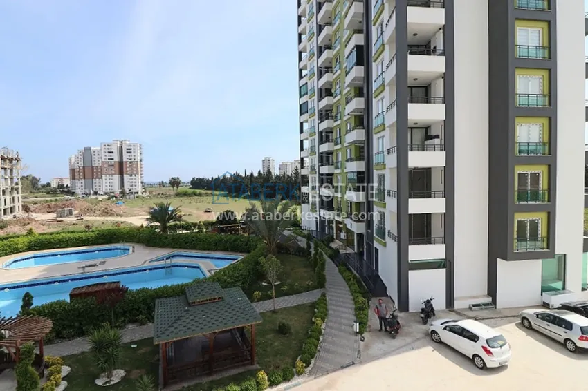 Квартира 2+1 с мебелью и техникой в молодом комплексе в районе Тедже-Мерсин 1 