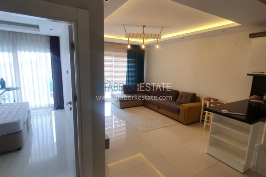 Приобрести Квартира 1+1 с мебелью рядом с морем в районе открытом для ВНЖ, Тосмур  1 