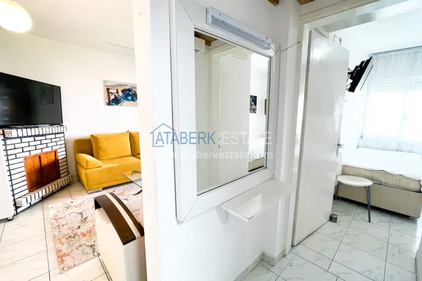 Приобрести Просторная двухкомнатная квартира с мебелью и камином в районе Алании – Конаклы 10 